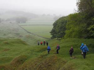 Down Tideswell Rake into mist