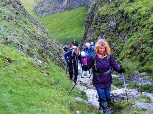 Julie climbs Cave Dale