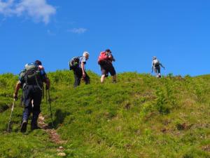 Angela leads the Yeavering Bell climb
